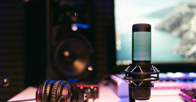 Microphone on studio blurred colorful background